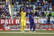 Mitchell Starc celebrates dismissing Rohit Sharma (right)